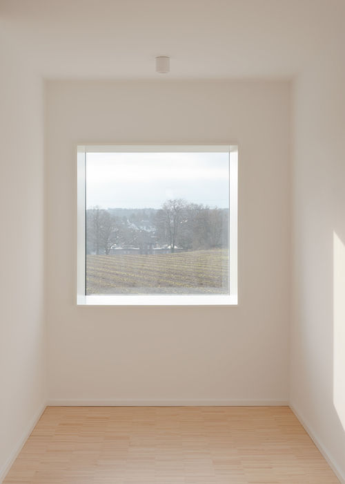 Hallway in private residence Aachen — corridor with integrated window niche and soft daylight