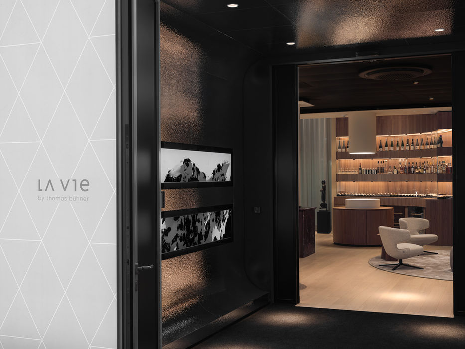 Entrance transition space La Vie Dusseldorf — futuristic corridor with illuminated display elements