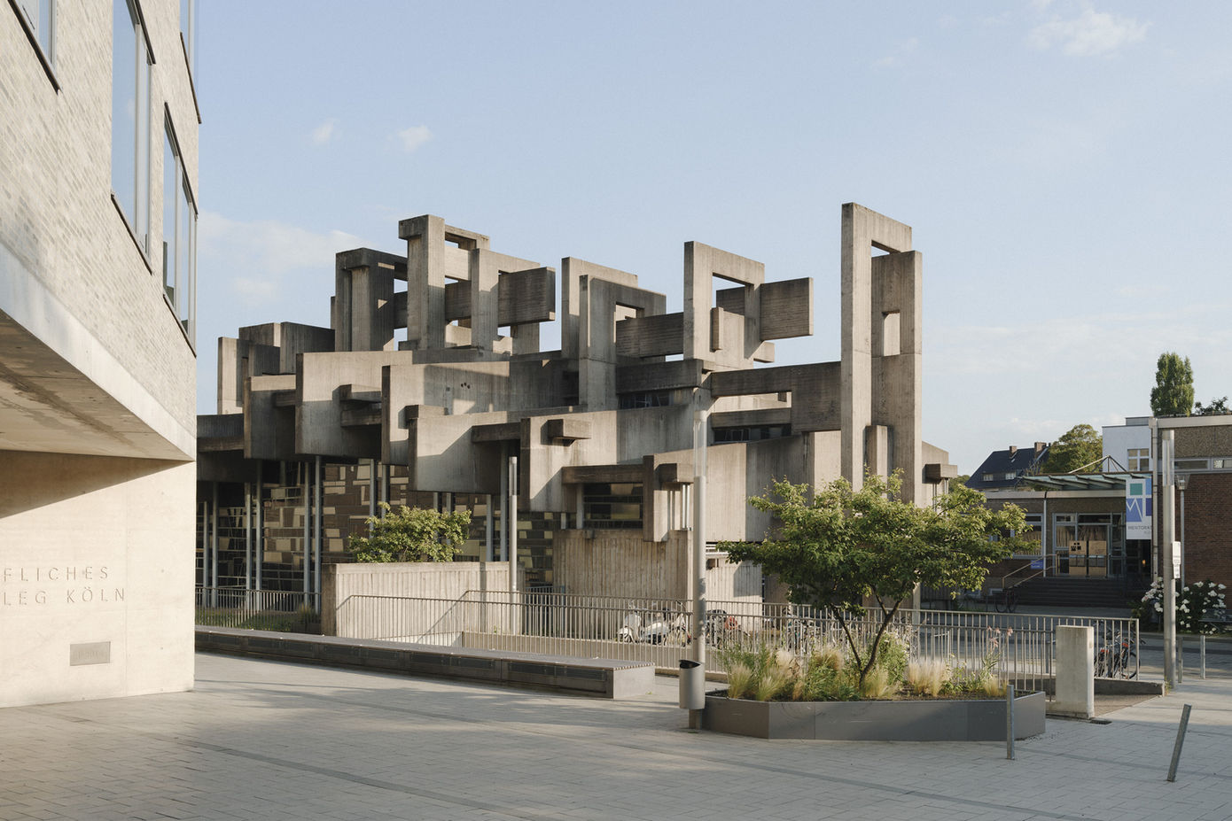 Church exterior in Cologne — brutalist building integrated into urban surroundings with institutional context