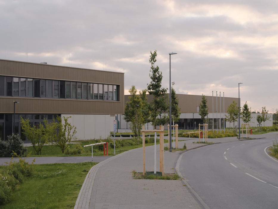 Exterior view of Gymnasium Zusestraße, Cologne — school building in evening light from street perspective