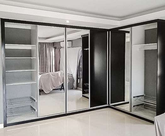 A Sliding Door Built in Cupboards with Mirror Inlays