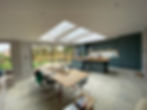 Bespoke kitchen extension with amazing sliding doors and skylight windows concrete lookalike floor tiling 