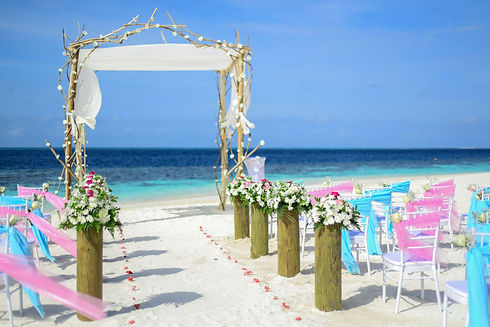 “Beach Wedding Under Blue Sky” by Asad Photo Maldives.jpeg