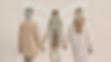 Back view of family of three female generations standing and holding hands. Age and genera