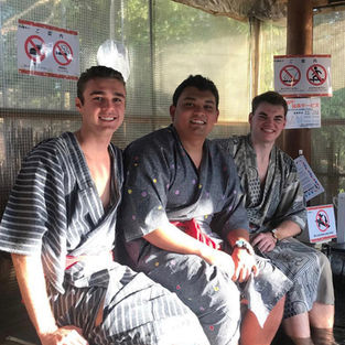 Brett Neilon with pledge brothers in Tokyo.jpeg