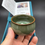 Thumbnail: Iron body style Celadon teacup with bottom shell follower