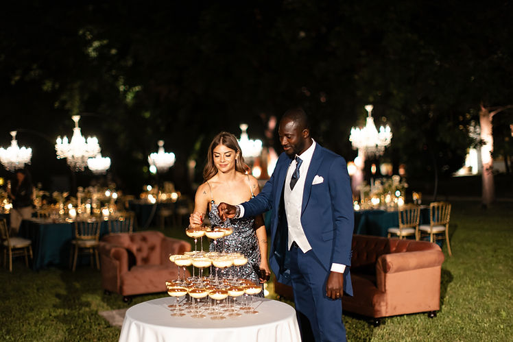 Emotional moment during an Italian wedding designed by Neroli Eventi with tiramisu tower cake