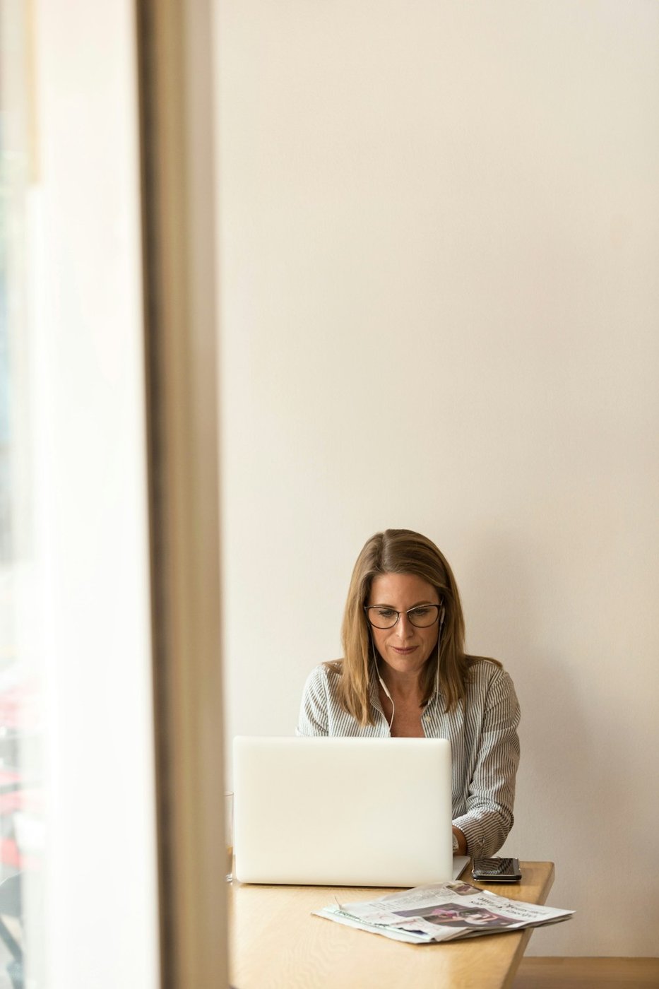 Illustrative photo of a professional working at her desk