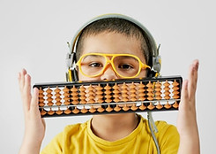 Child solving mental math using abacus without bead movement