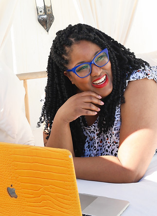 Taja smiling with laptop.jpeg