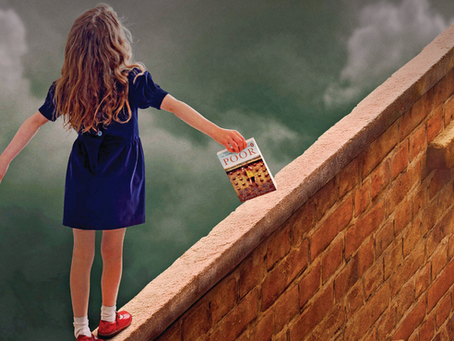 Young Katriona balancing on a wall