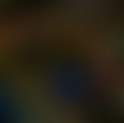 Tangled multicolored wires, featuring pink, yellow, green, and blue, create a chaotic pattern against a dark background.