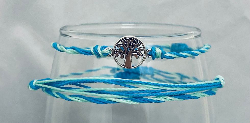 Thumbnail: 3 Brazilian cord adjustable bracelets in blue and mint green. One bracelet has a small tree in a circle in the center.