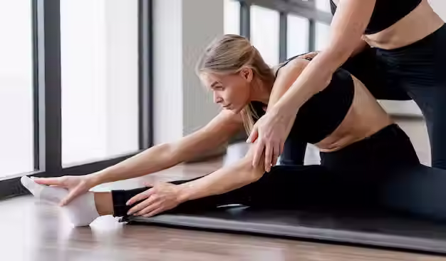 Pilates session with attentive guidance for posture, flexibility, and body awareness.