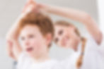 Pretty happy physiotherapist glad of results in boy's physiotherapy of injured shoulder.jp