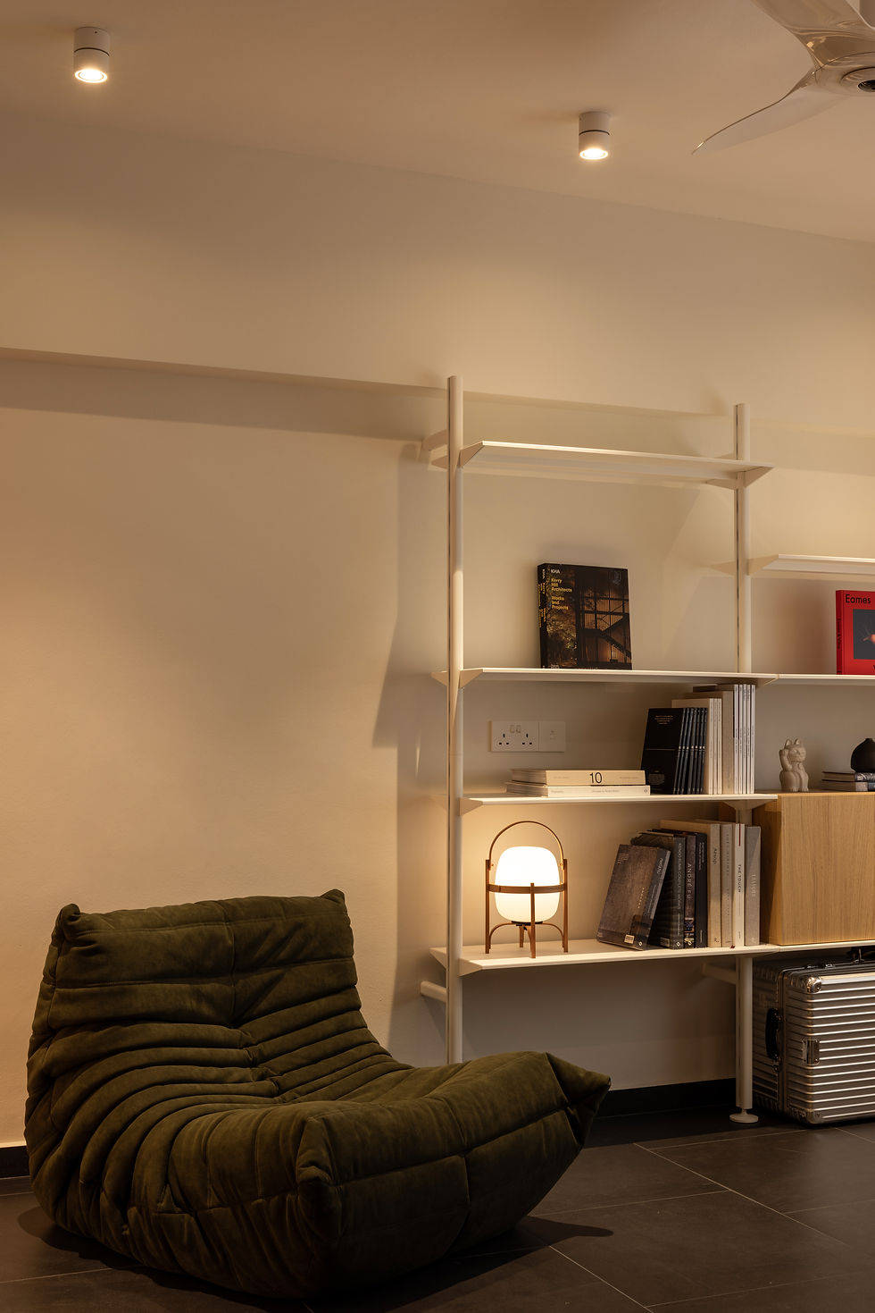 NAMA secondary foyer featuring custom cabinetry and a curated artwork display within a calm material palette.