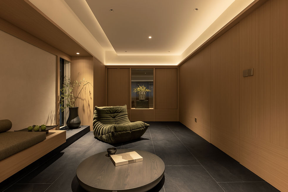 NAMA lounge featuring pivoting timber panels that connect to the study, alongside concealed doors seamlessly integrated within the timber-lined walls.