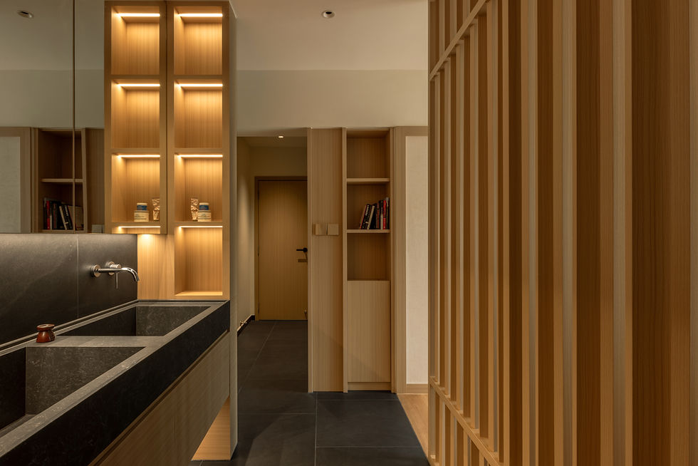NAMA master suite organised as a sequence of wardrobe corridor, vanity and sleeping spaces, connected through layered timber elements.