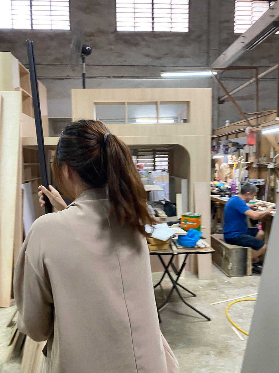 Team members working within the workshop environment, highlighting the close relationship between design development and craftsmanship during Hock Hoon's early years.