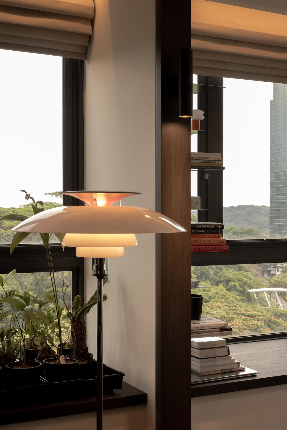 Interlace bedside detail featuring a continuous window ledge, integrated reading light and panoramic greenery views.