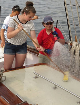 Trainee swabbing the deck. Summer camp.