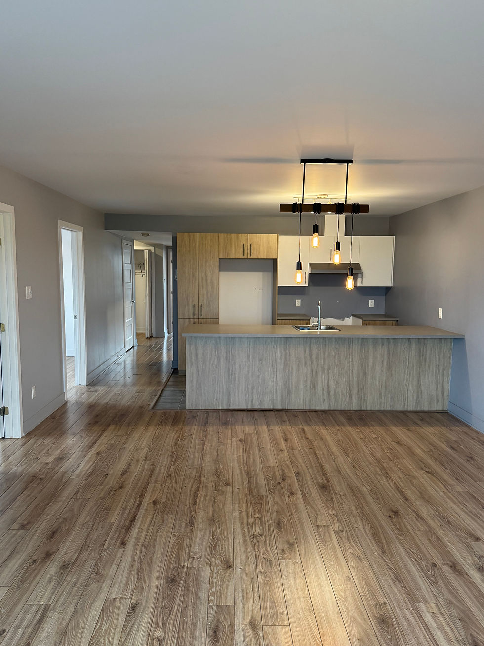 Front view of a green single-family house with a small porch and multiple windows.