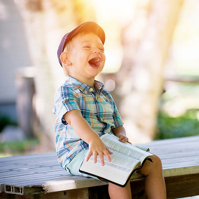 boy%20sitting%20on%20bench%20while%20holding%20a%20book_edited.jpg