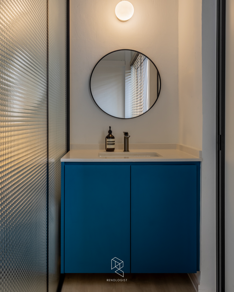 bathroom with colourful terrazzo tiles, a glass shower screen and modern fixtures.