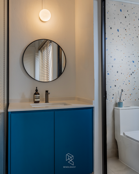 bathroom with colourful terrazzo tiles, a glass shower screen and modern fixtures.