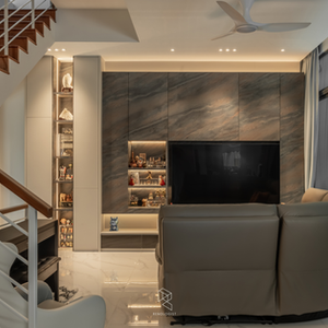 Modern contemporary semi-detached living room featuring a stone-look TV feature wall, illuminated display niches, timber staircase, marble flooring, and warm ambient lighting.