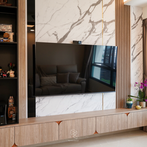 Modern Wabi-Sabi luxury living room featuring a marble TV feature wall, fluted wood panels, custom TV console, and warm wood cabinetry.