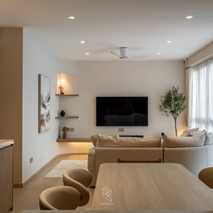 Modern Scandinavian living room with curved cream sofa, floating wood TV console, marble coffee table, sheer curtains, and warm neutral interior design.