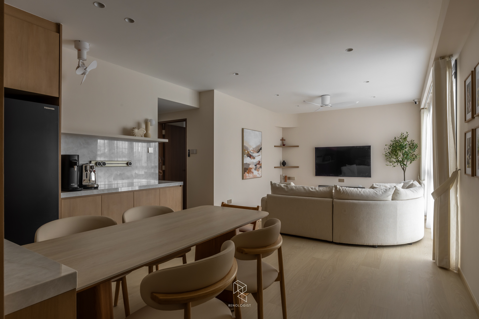 Modern Scandinavian living room with curved cream sofa, floating wood TV console, marble coffee table, sheer curtains, and warm neutral interior design.