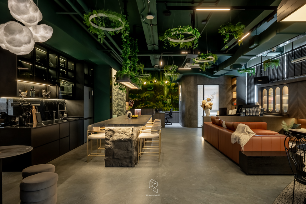 Interior design showroom lounge with curved green seating, illuminated material displays and hanging greenery.