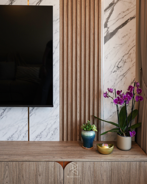 Modern Wabi-Sabi luxury living room featuring a marble TV feature wall, fluted wood panels, custom TV console, and warm wood cabinetry.