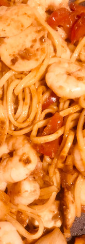 Return the prawns and fish balls to the wok with a little more sauce