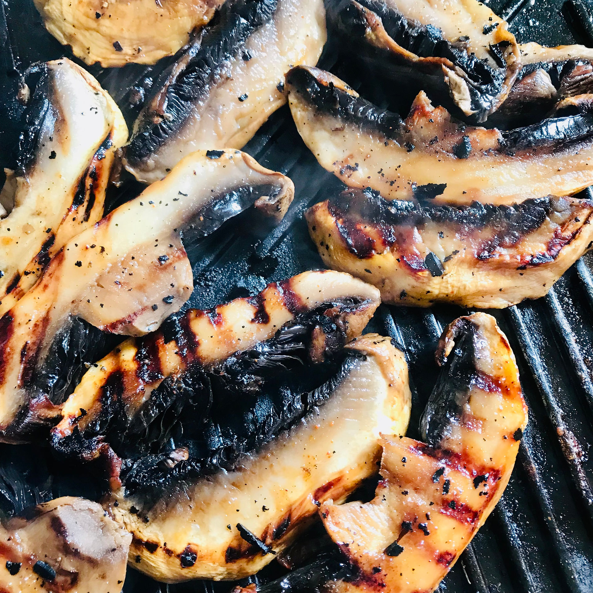 Once you've sliced the mushrooms, baste lightly with the honey, spice and oil mix as you turn them gently