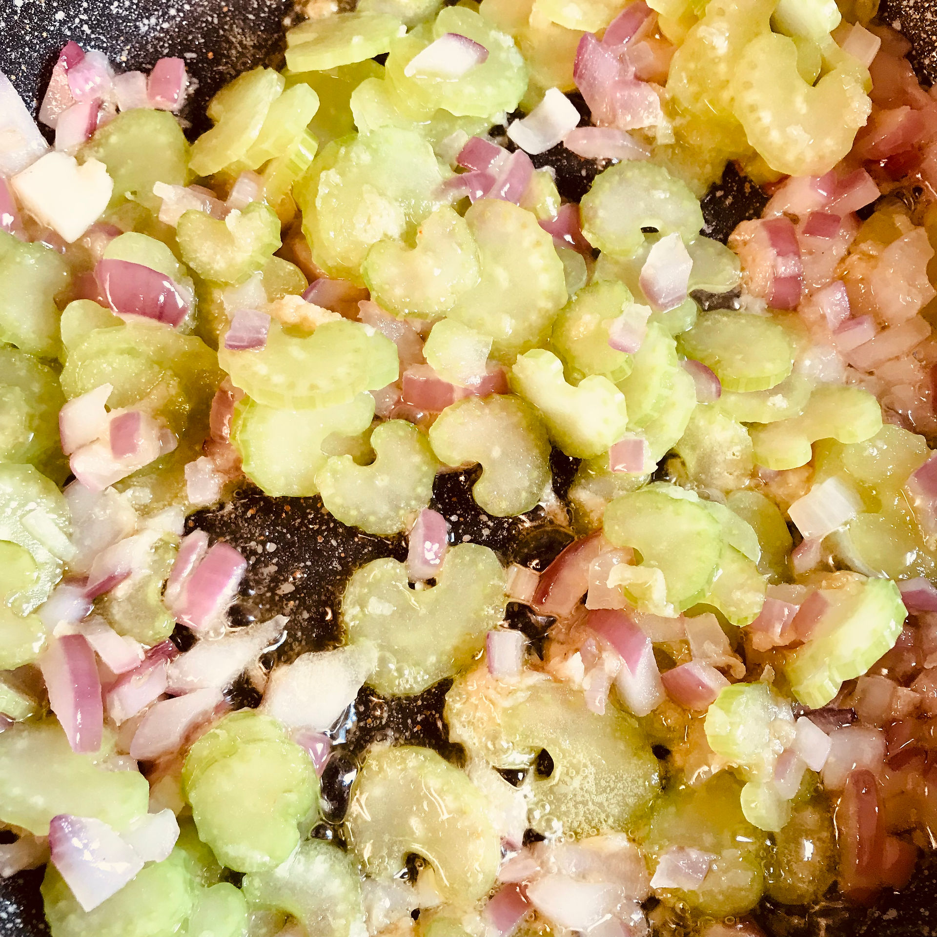 Add the celery even before the onions have browned and stir in