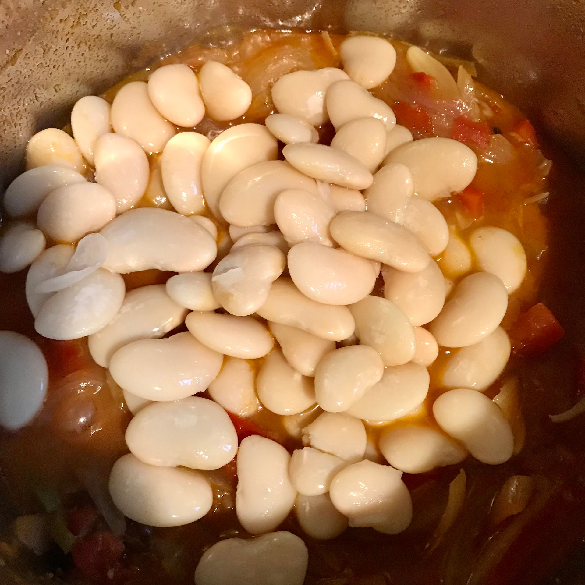 Add the butterbeans to the reducing sauce