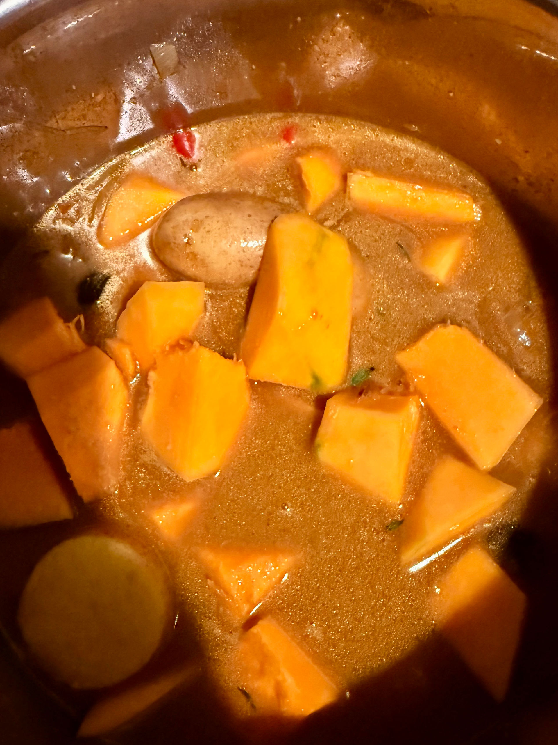 Add the pumpkin, potatoes and remaining stock