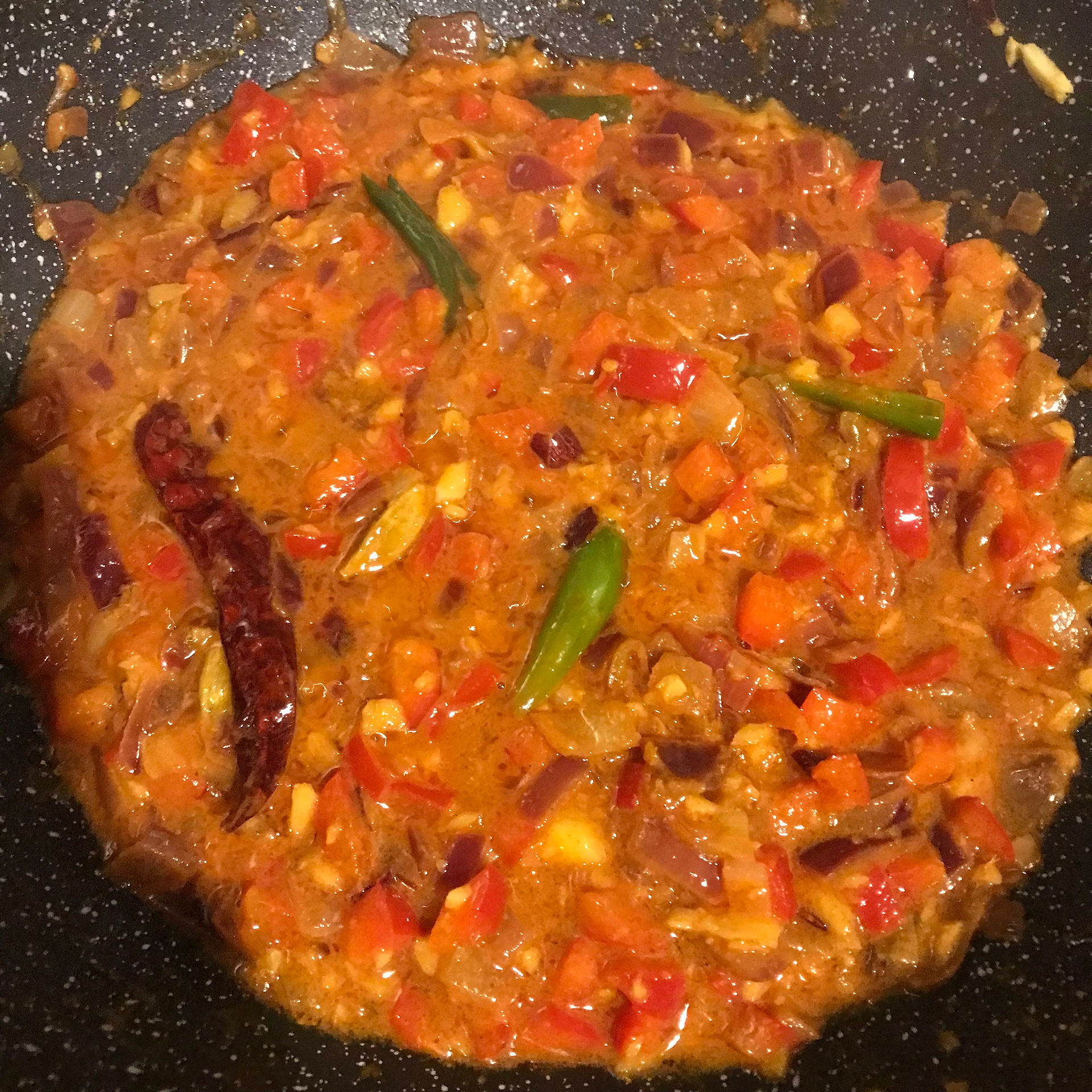 Gently simmer until all the curry ingredients reduce by half
