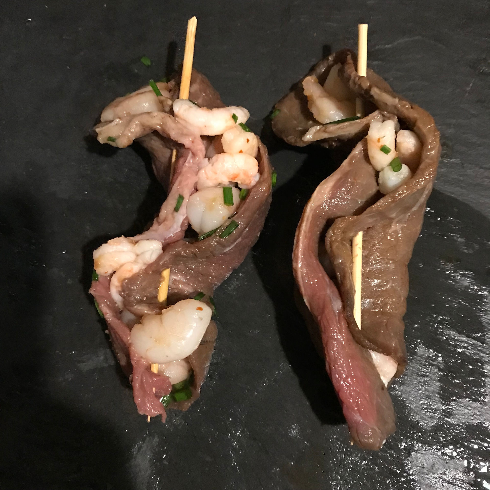 Fold the steaks into wraps and secure with thin skewers