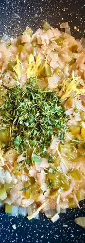 When the wine has cooked down, add the thyme, lemon zest and half of the lemon juice