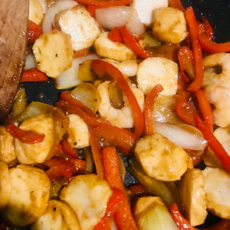 Add the raw king prawns and fish balls together with the remaining Hoisin sauce