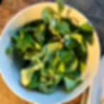 A salad of mixed leaves, pitted black olives and crostini croutons