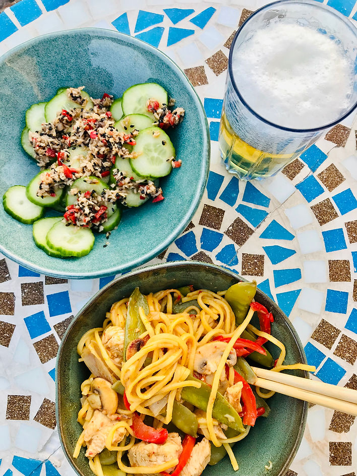 Spicy chicken and noodle stir fry with chllli, coconut, cucumber salad