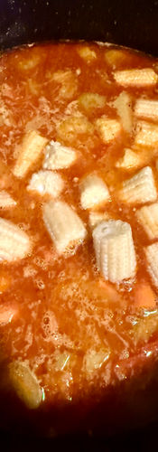 Add the lime, coconut milk and baby sweetcorn