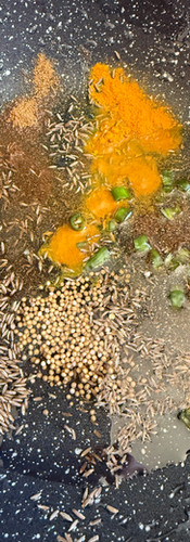 Cook all of the spices an chillies in the heated oil until the aromas release