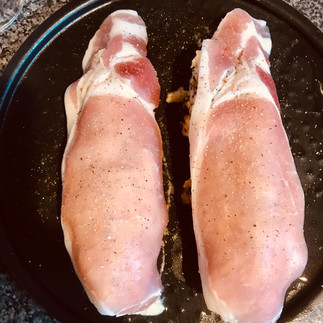 Place the rest of the mustard and apple marinade onto the half-roasted chicken and drape with bacon