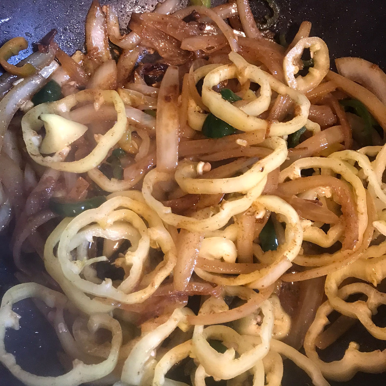 Add the bell peppers when the onions have browned